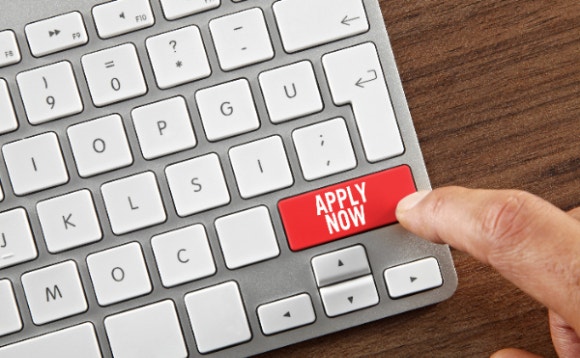 A finger pressing a red button on a keyboard AI-generated content may be incorrect.
