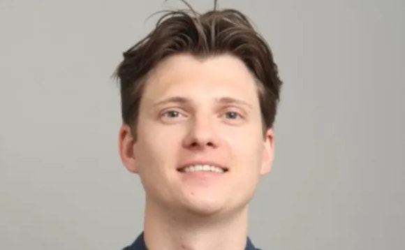 A person smiling for a picture AI-generated content may be incorrect.