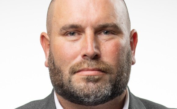 A person with a beard AI-generated content may be incorrect.