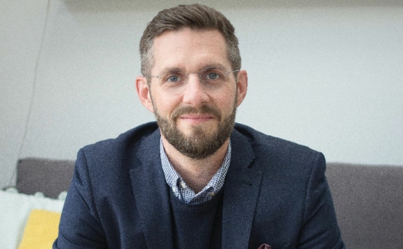 A person with a beard AI-generated content may be incorrect.