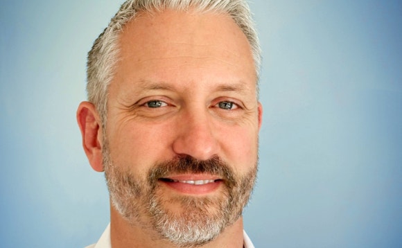 A person with a beard and mustache AI-generated content may be incorrect.